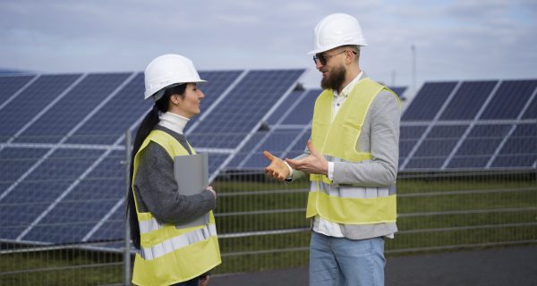 medium-shot-engineers-talking-outside