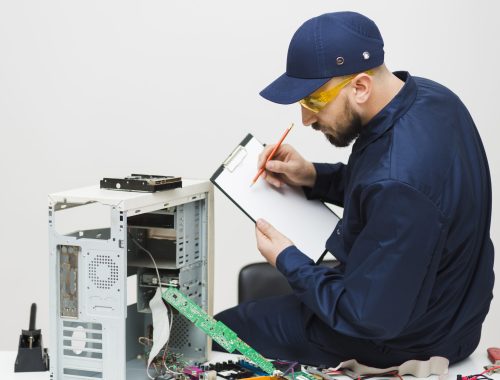 sideways-man-repairing-computer